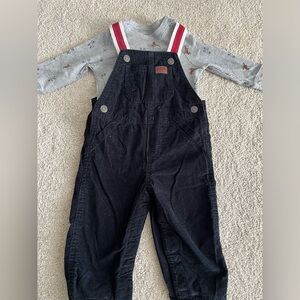 Carter’s black corduroy overalls and gray shirt